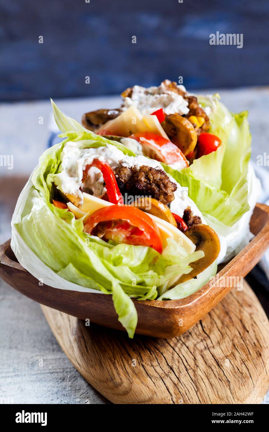 Low carb burgers with bun salad, roasted vegetables and tzatziki sauce Stock Photo