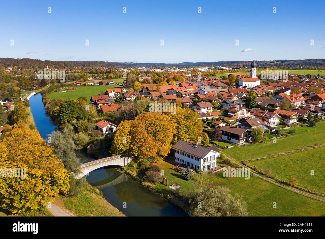 Germany, Bavaria, Geretsried, Aerial view of countryside town in autumn Stock Photo