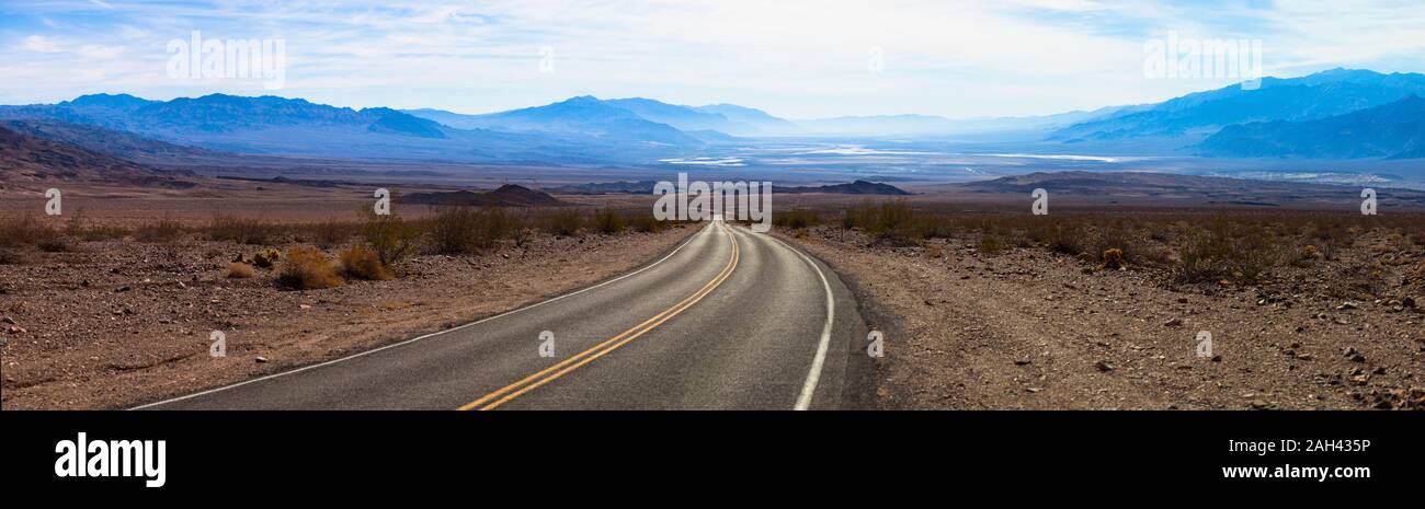 USA, California, Panorama of empty highway in Death Valley Stock Photo