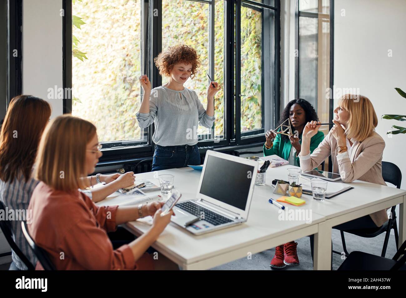 Businesswomen having a meeting in office Stock Photo - Alamy
