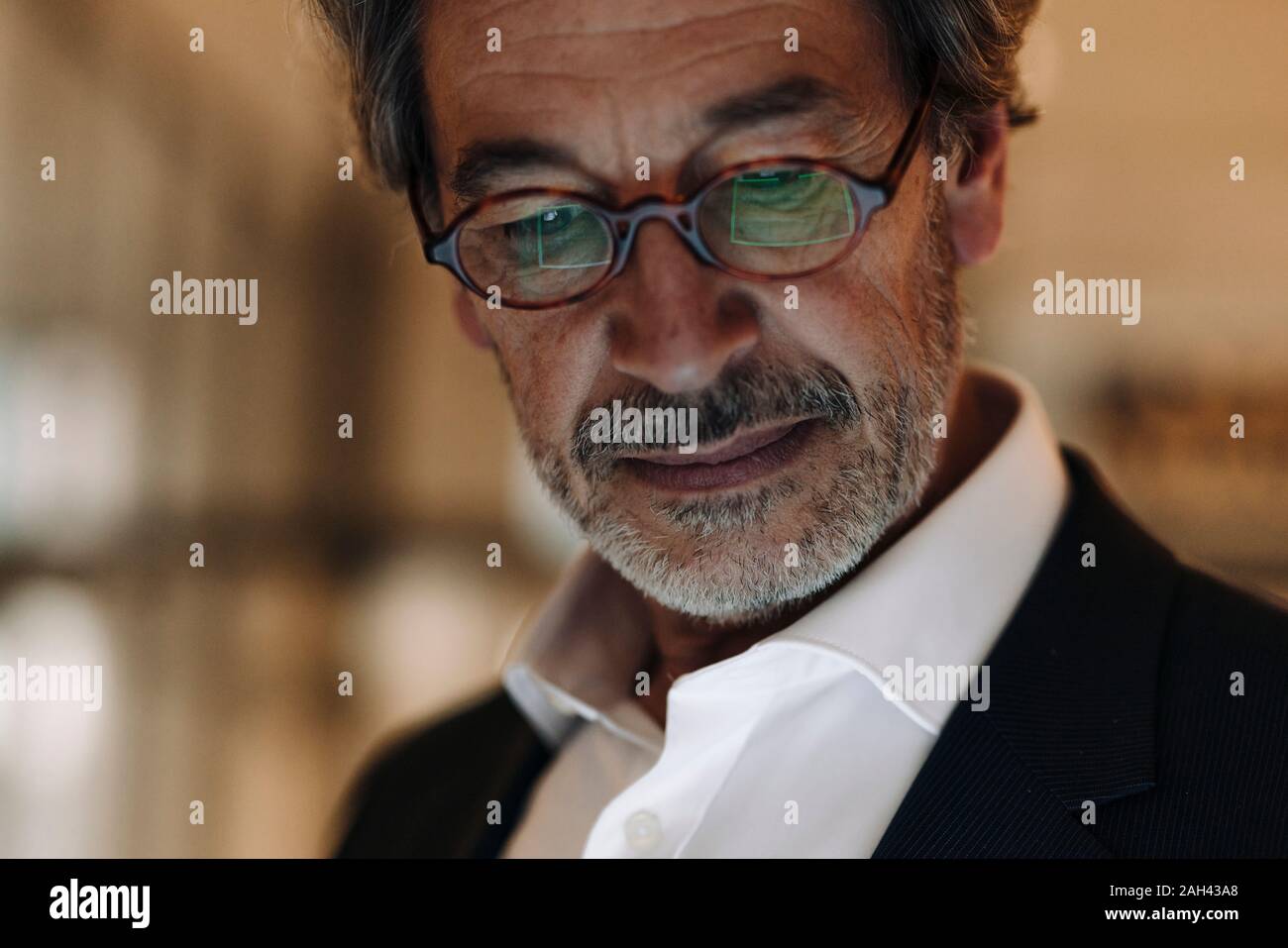 Portrait of senior businessman wearing glasses Stock Photo