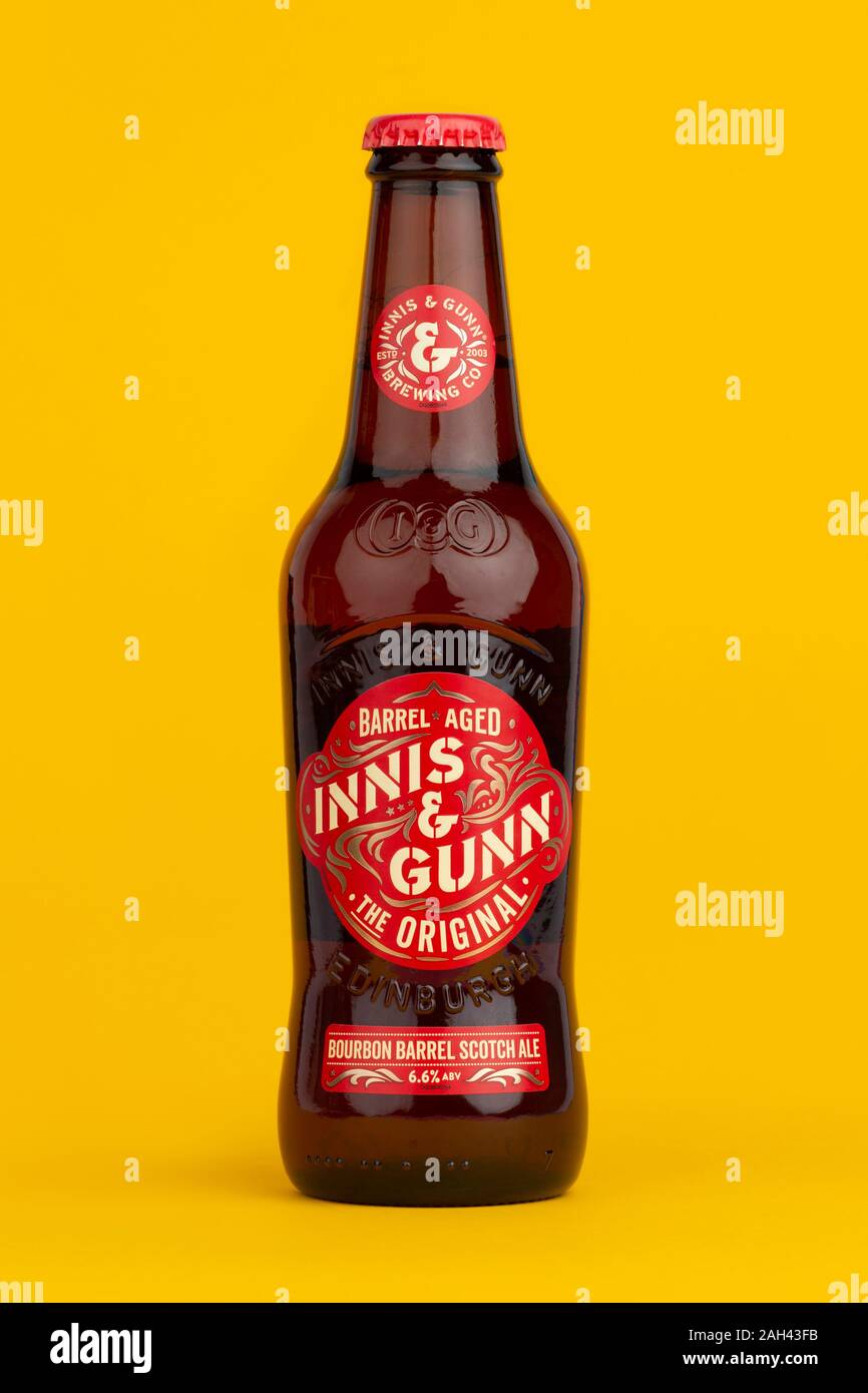 A bottle of Innis & Gunn bourbon barrel scotch ale shot on a yellow background. Stock Photo