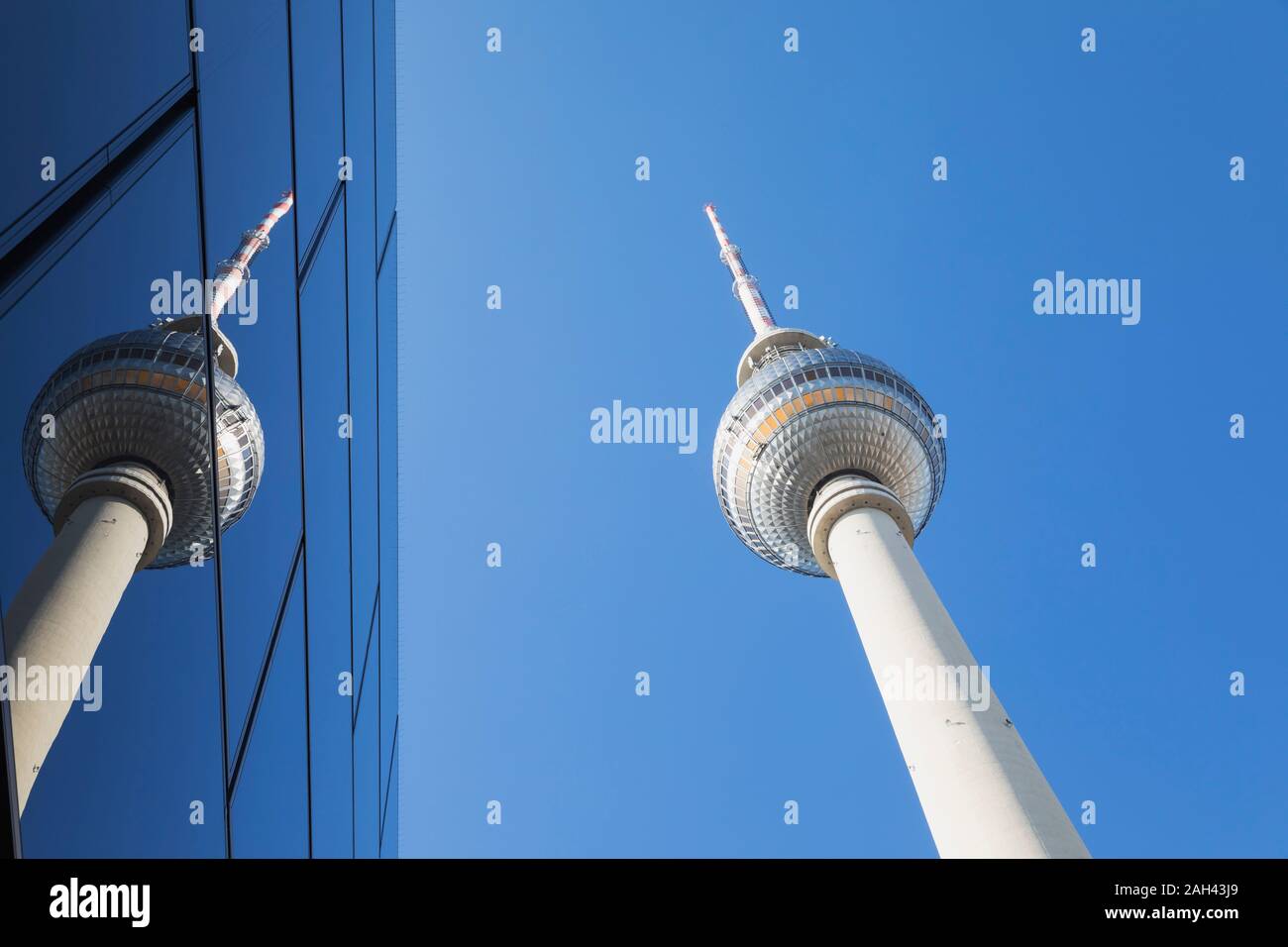 Germany, Berlin, Low angle view of TV Tower and glass building Stock Photo