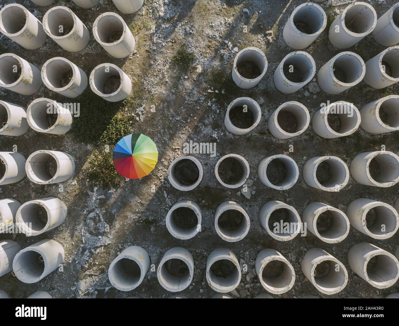 Aerial view of umbrella and concrete hoops Stock Photo