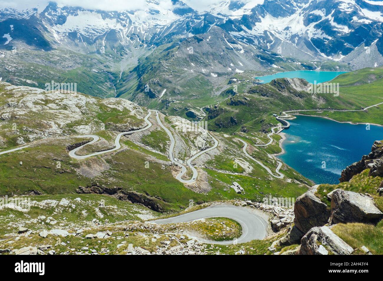Italy, Piedmont, High angle view of long winding road in Gran Paradiso National Park Stock Photo