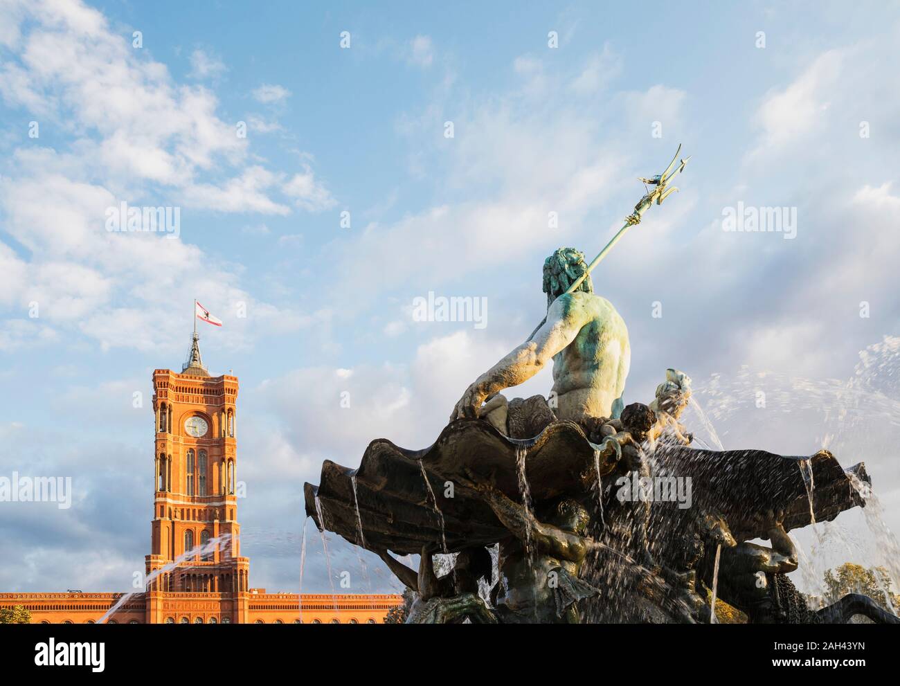 Germany, Berlin, Neptune Fountain against Rotes Rathaus building Stock Photo