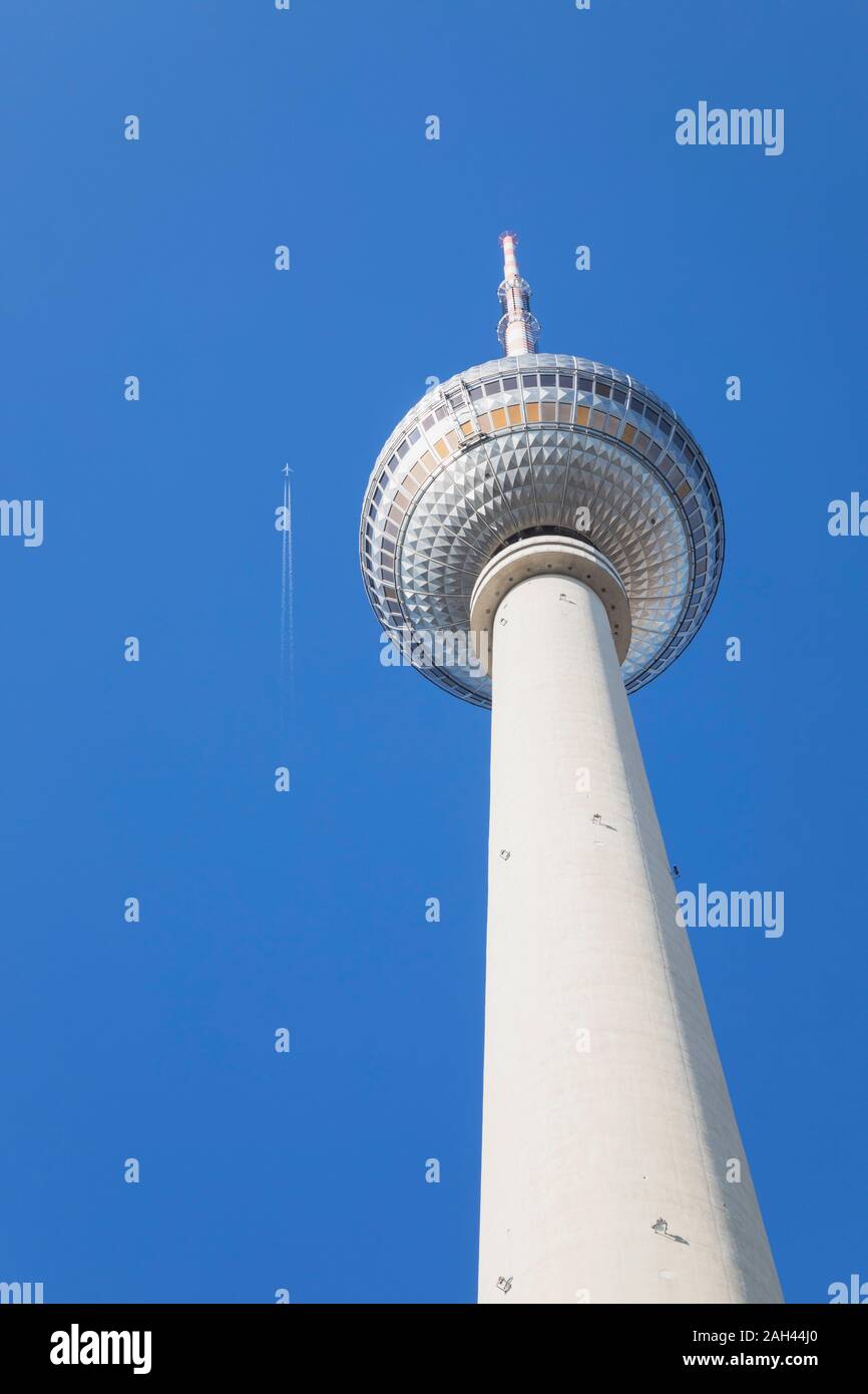 Germany, Berlin, Low angle view of Berlin TV Tower standing against clear blue sky Stock Photo