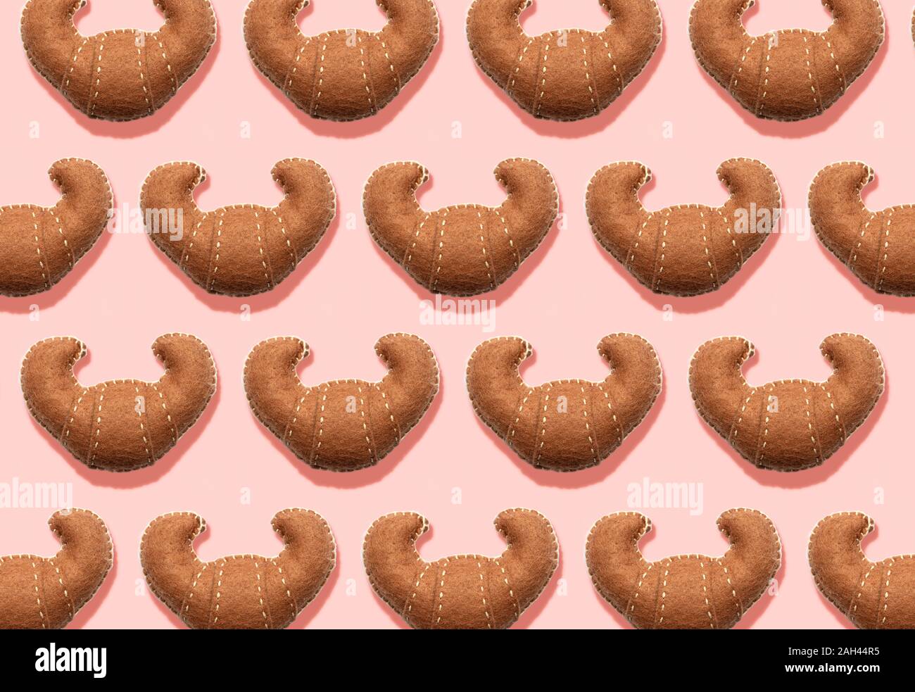 3D Illustration, Plush fake croissants pattern on cream background Stock Photo