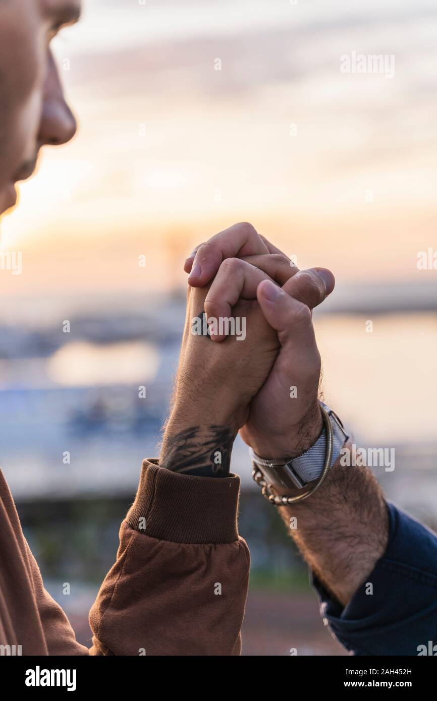 Close-up of gay couple holding hands Stock Photo - Alamy