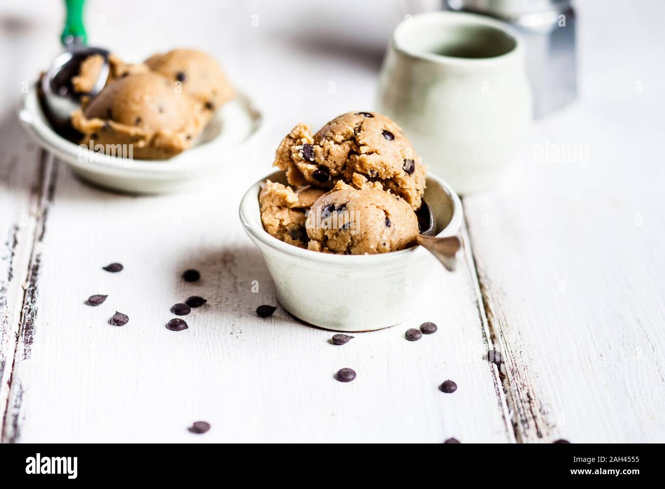 Raw vegan chocolate chip cookie dough made from almond meal, coconut flour, coconut oil, chocolate chips and maple syrup Stock Photo