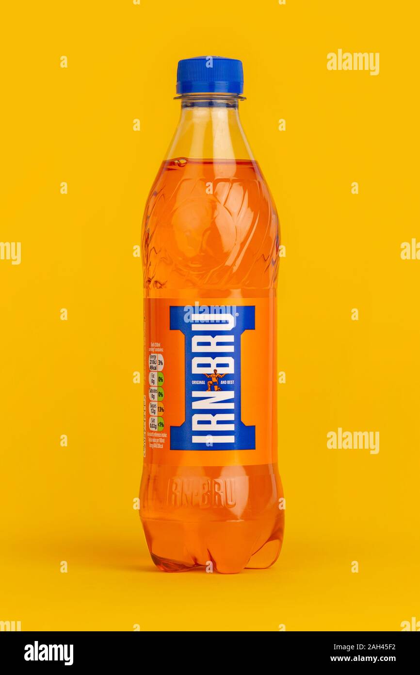 A bottle of Barr Irn Bru shot on a yellow background. Stock Photo