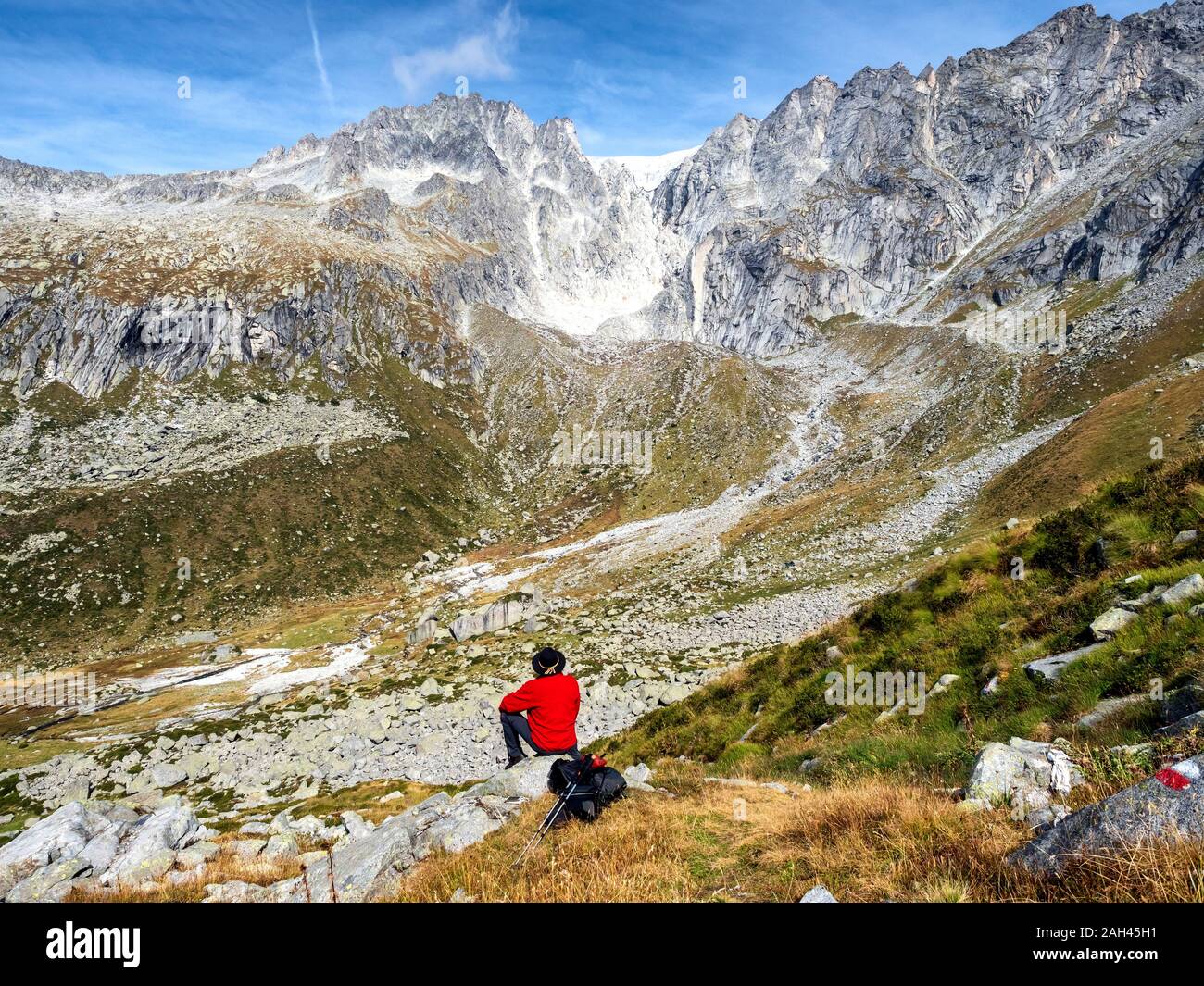 Italy, Brescia province, Adamello Alps, Val Salarno, Glacier, hiker looking to glacier Stock Photo
