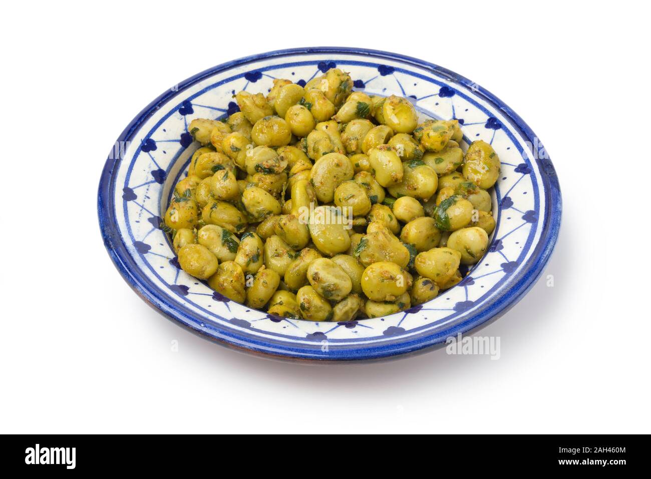 Traditional Moroccan dish with broad bean salad and herbs isolated on white background Stock Photo