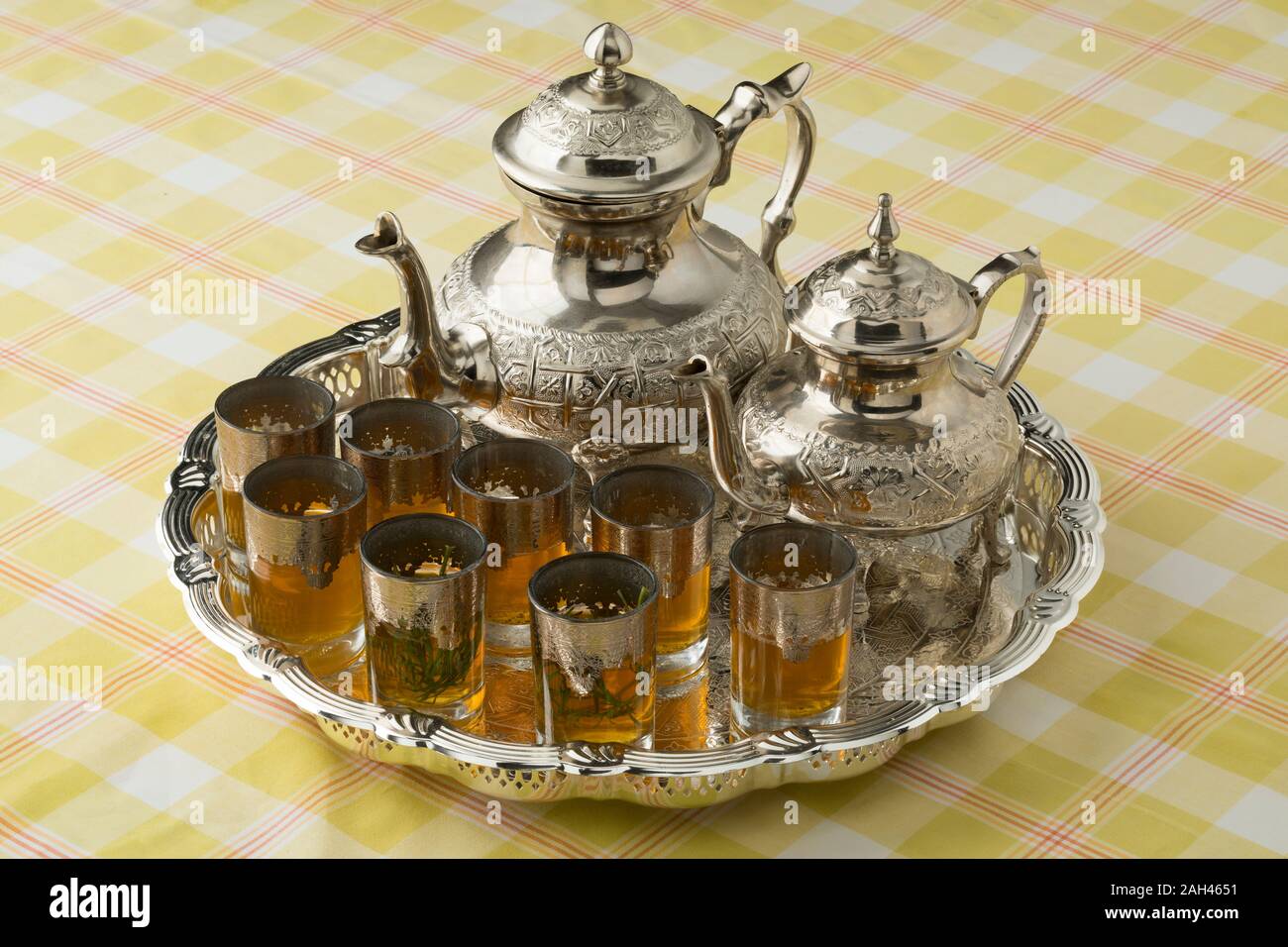 Moroccan tea tray with two teapots with and without sugar, and glasses with and without absinthium herb Stock Photo