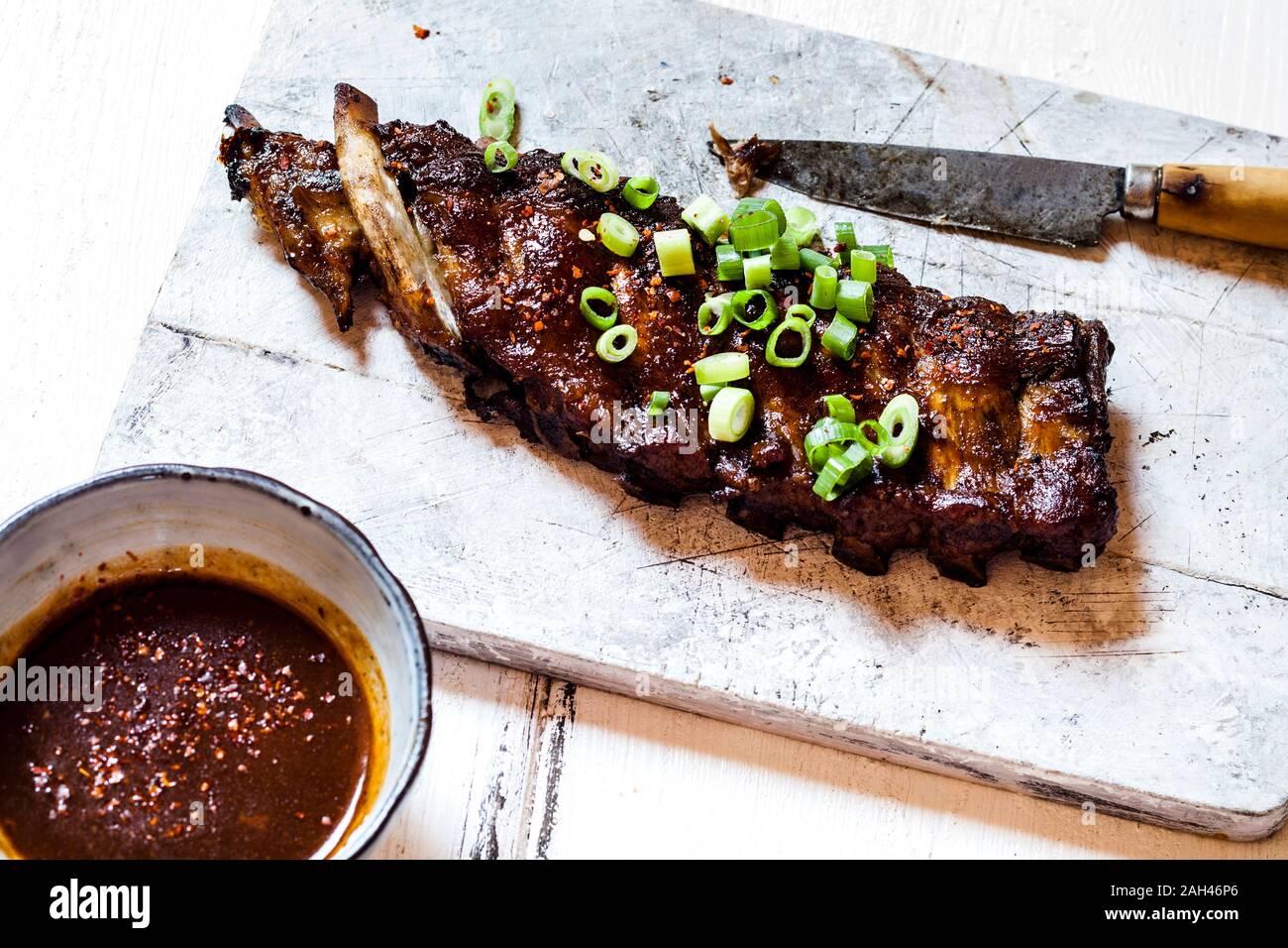 Sticky spareribs with scallions and homemade barbecue sauce Stock Photo