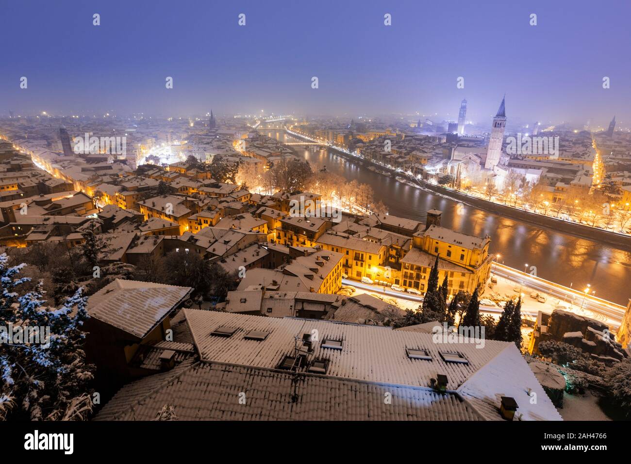 Italy, Verona, High angle view of city illuminated at night in Winter Stock Photo