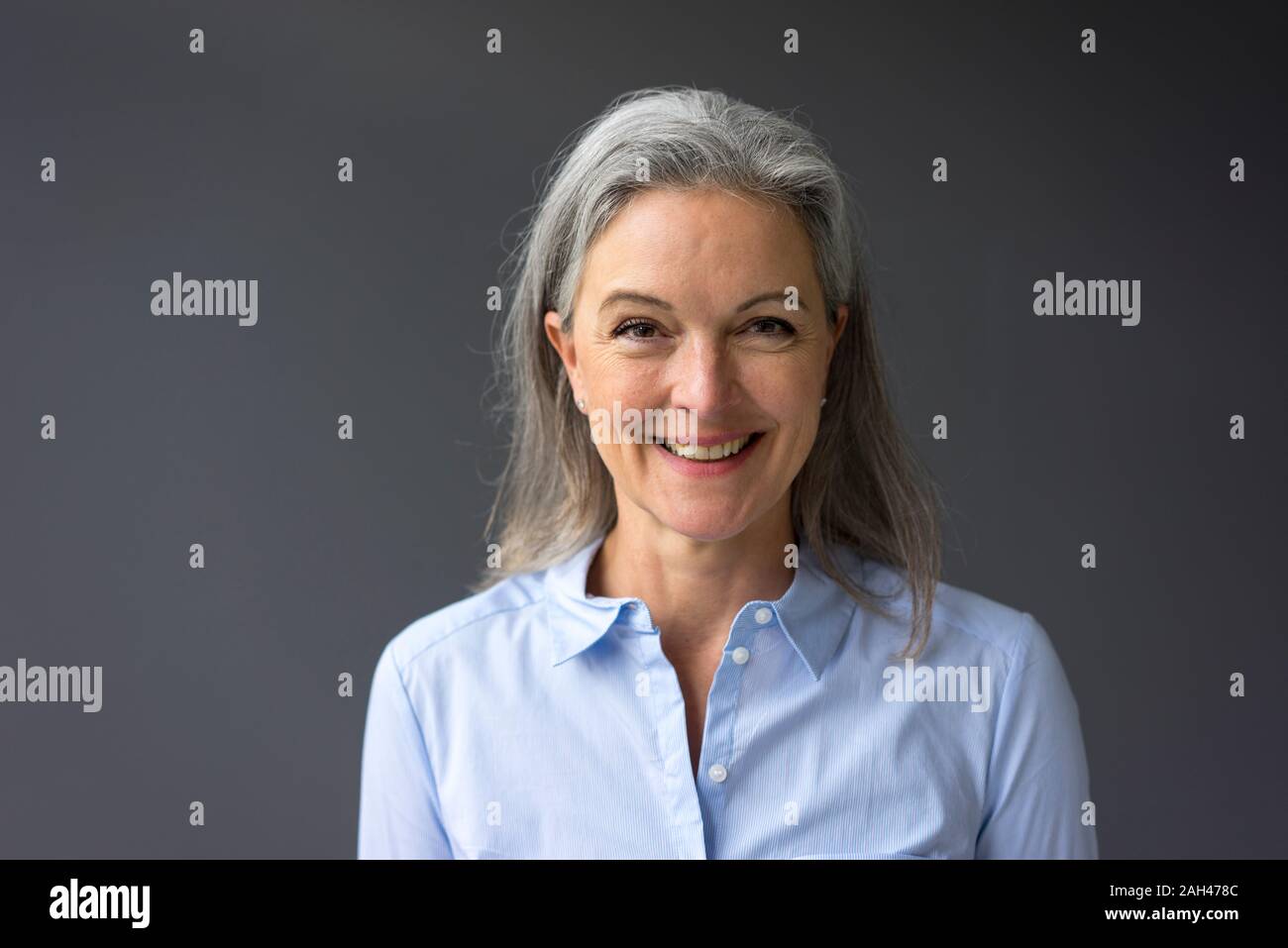 Portrait of happy mature businesswoman Stock Photo