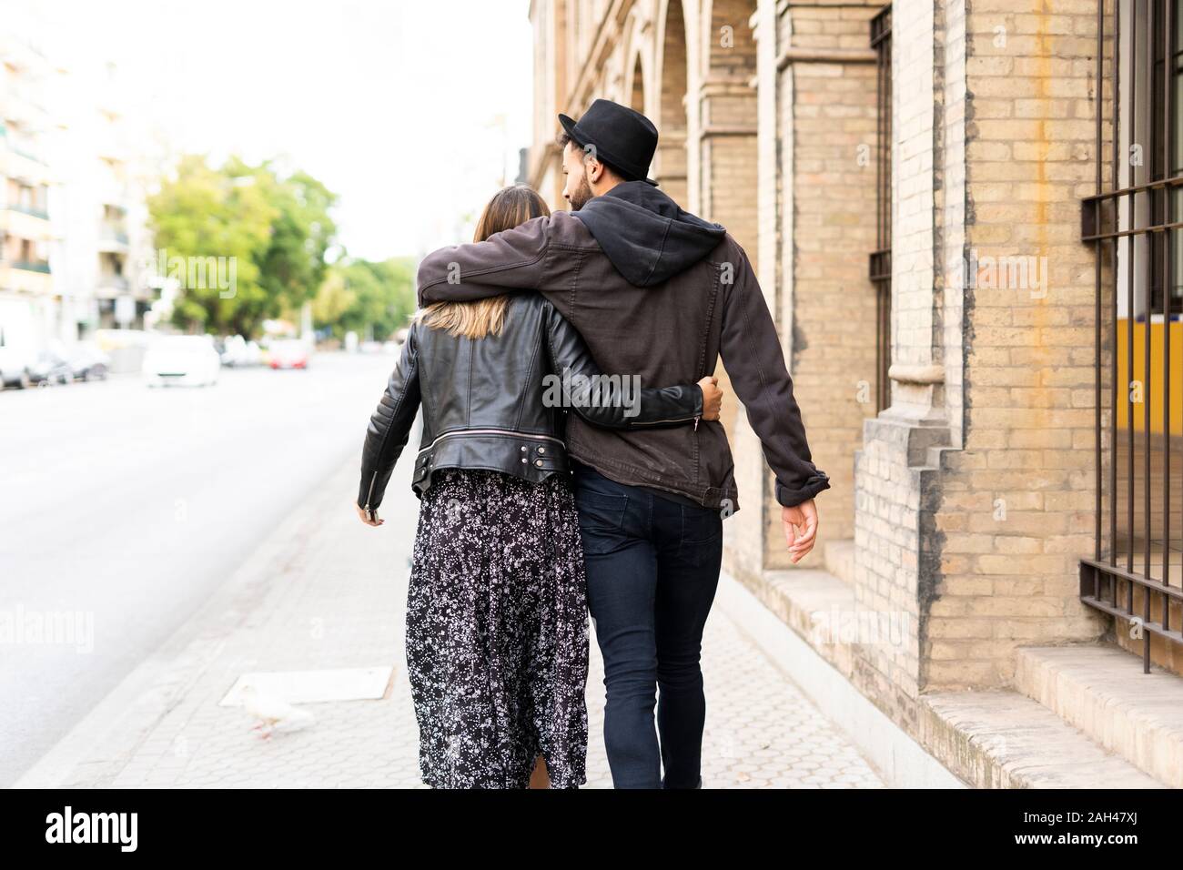 Back View Of Young Couple In Love Walking Arm In Arm In The City Stock Photo Alamy Back View Of Young Couple In Love Walking Arm In Arm In The City Stock Photo Alamy