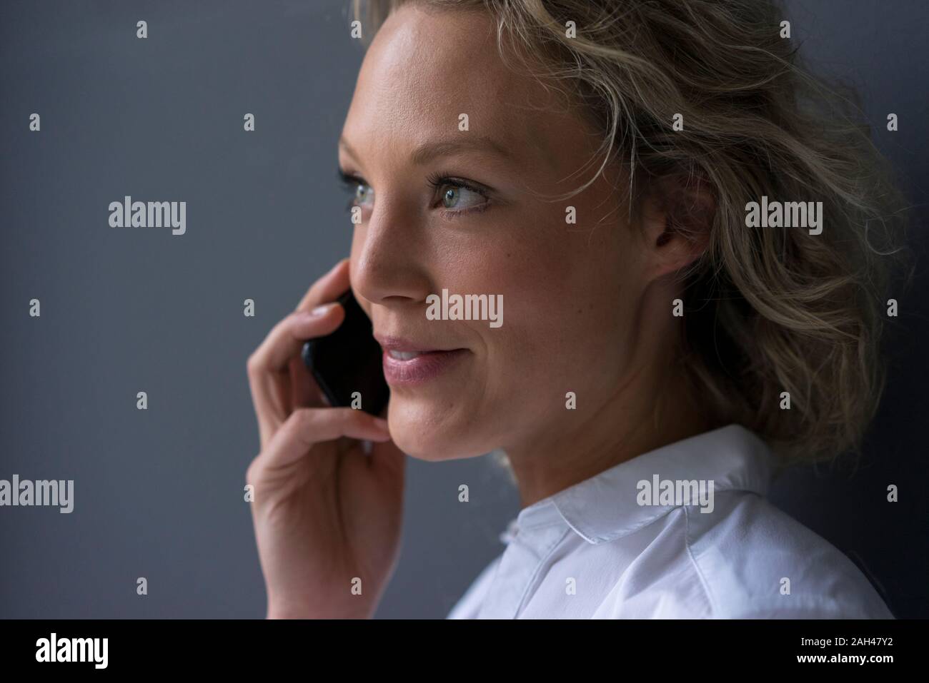 Portrait of smiling young businesswoman on the phone Stock Photo
