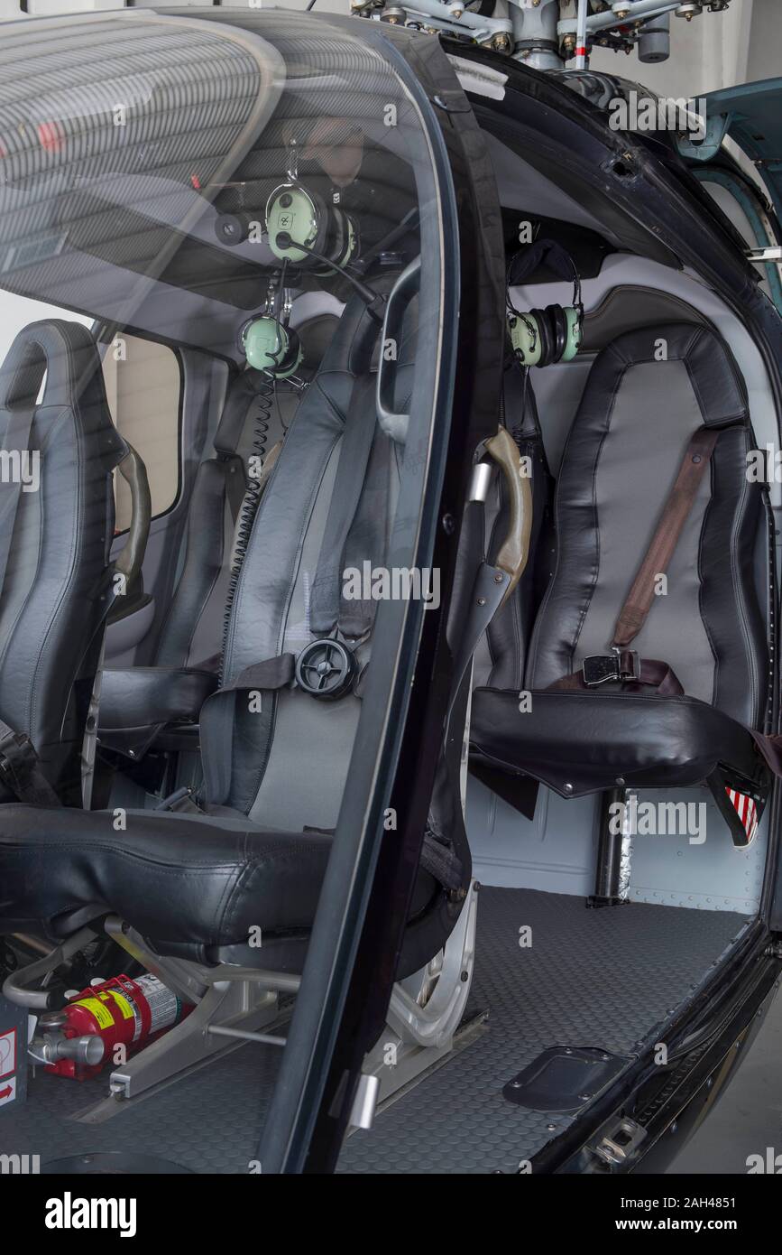 Helicopter interior safety belts and seats for passengers of Eurocopter luxury helicopter. Stock Photo