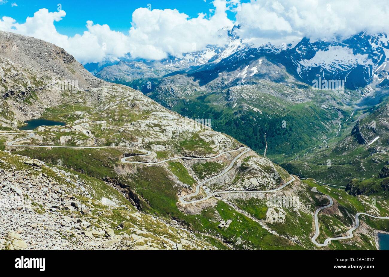 Italy, Piedmont, High angle view of long winding road in Gran Paradiso National Park Stock Photo
