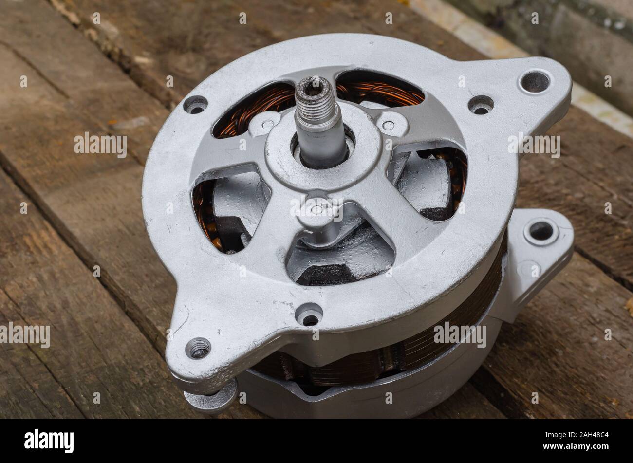 Reconditioned auto generator. Closeup of a used generator after major