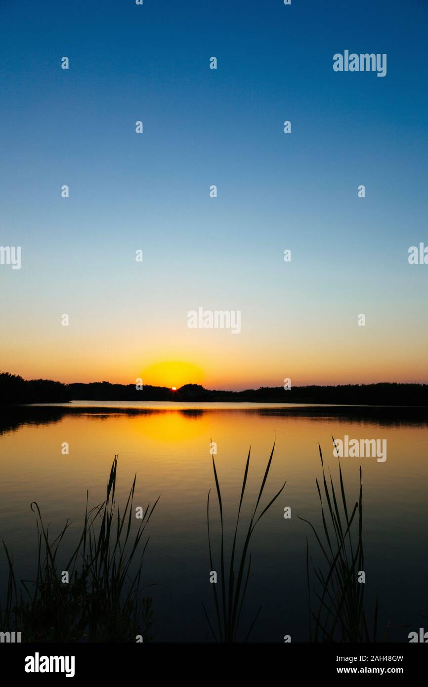 USA, Florida, Clear sky over lake in Everglades National Park at sunset Stock Photo