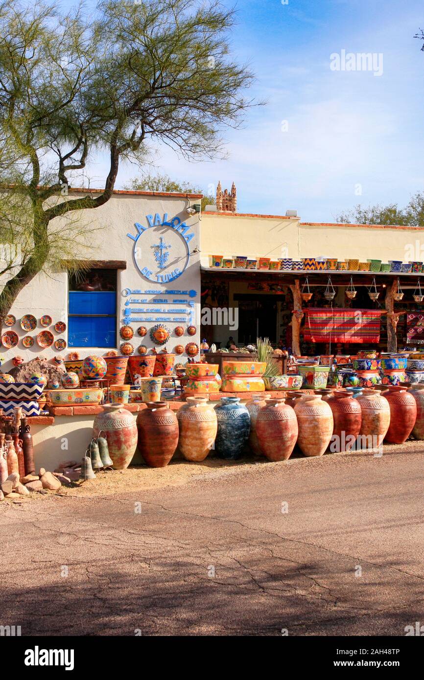 Colorful Mexican pots, stonewear and sculptures outside La Paloma store