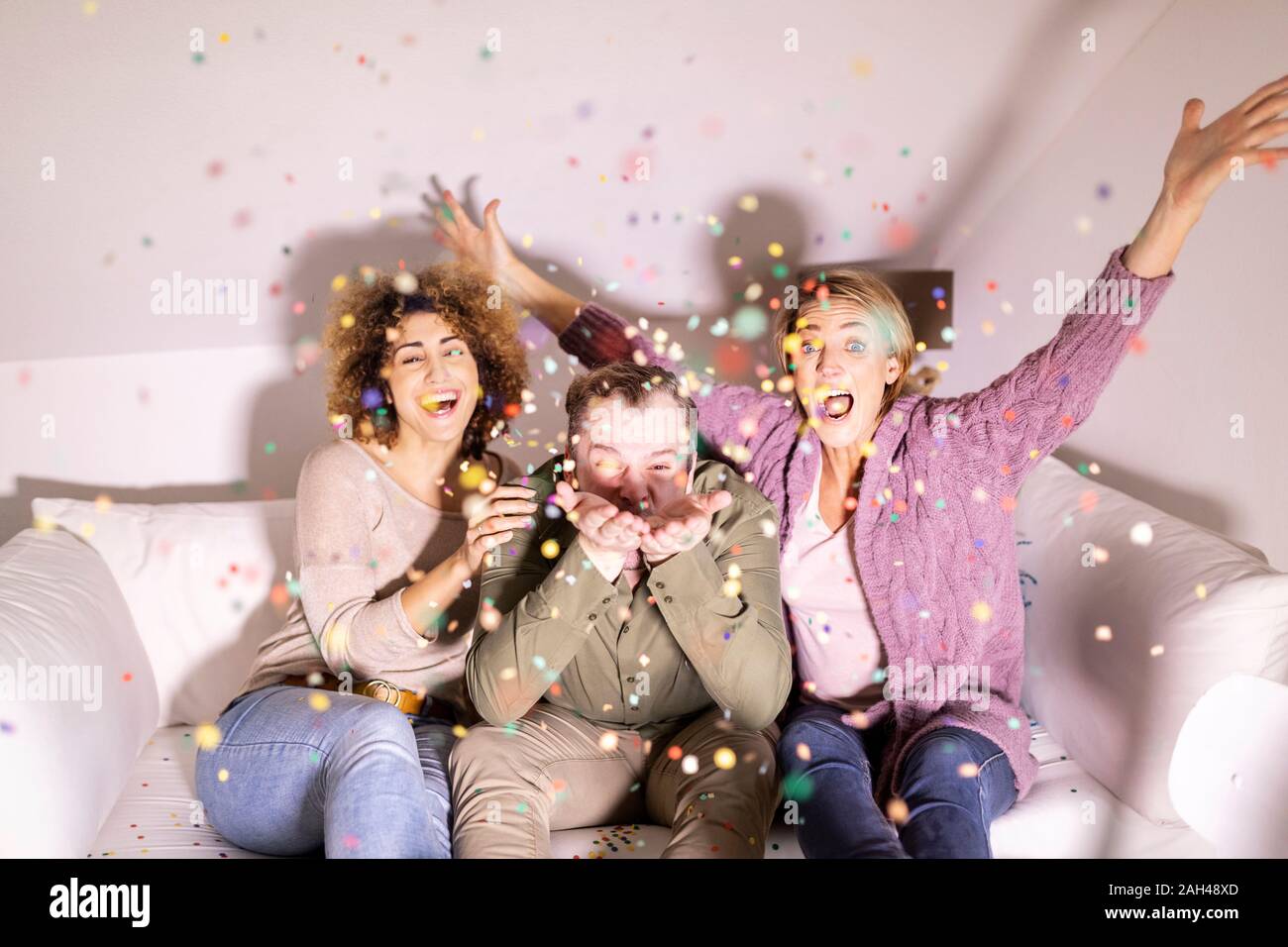 Best friends celebrating party with confetti Stock Photo