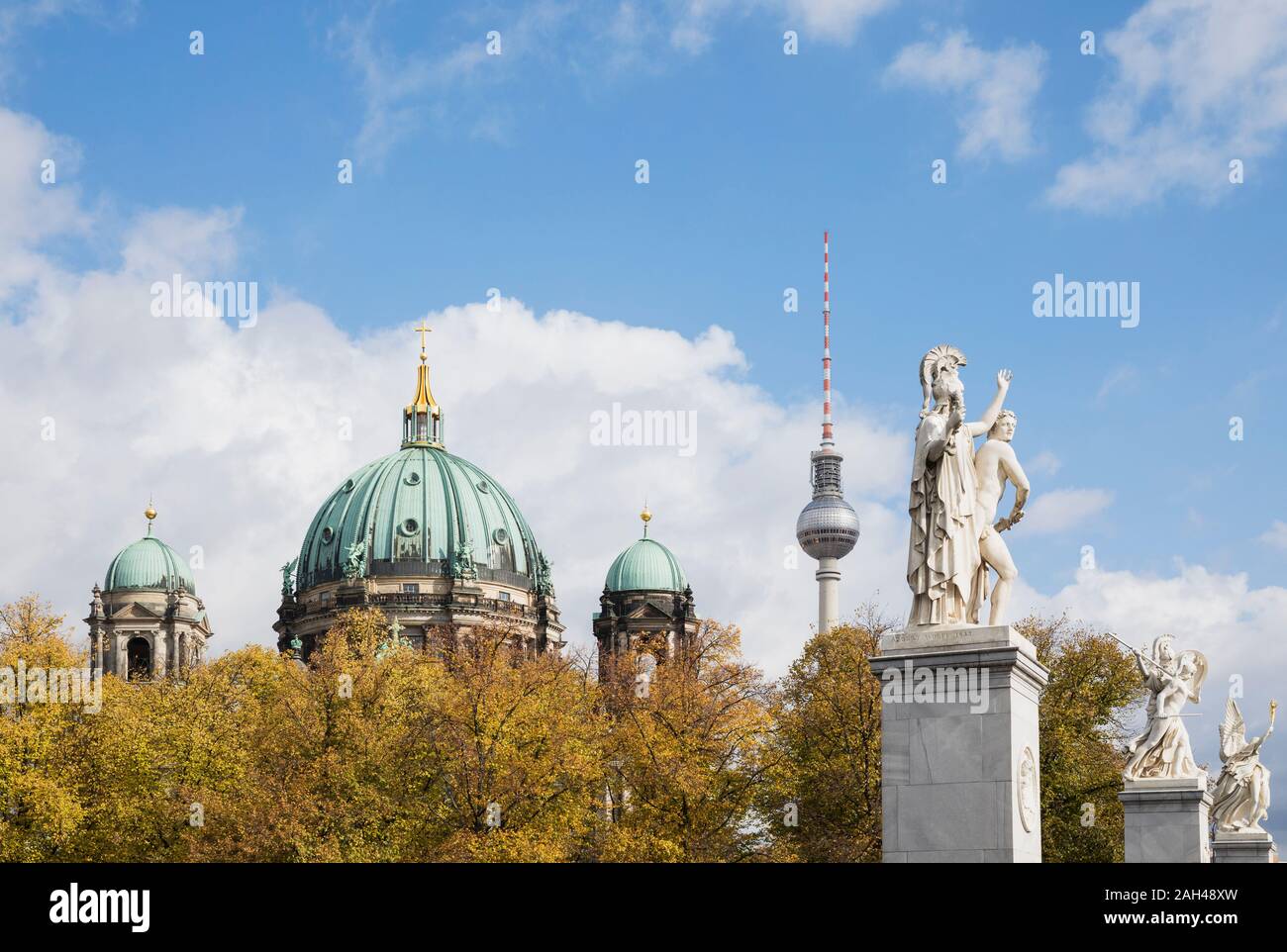 Germany, Berlin, Statues of Schlossbrucke with Berlin Cathedral and Berlin TV Tower in background Stock Photo