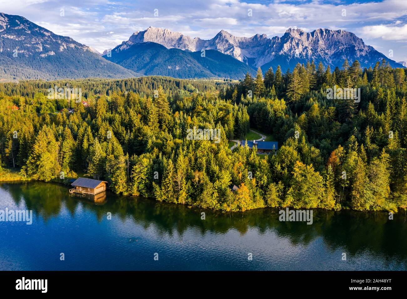 Germany, Bavaria, Boathouse on forested lakeshore of Barmsee lake Stock Photo