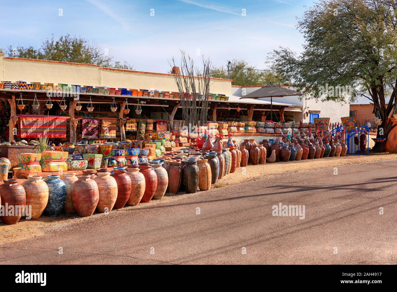 Colorful Mexican pots, stonewear and sculptures outside La Paloma store