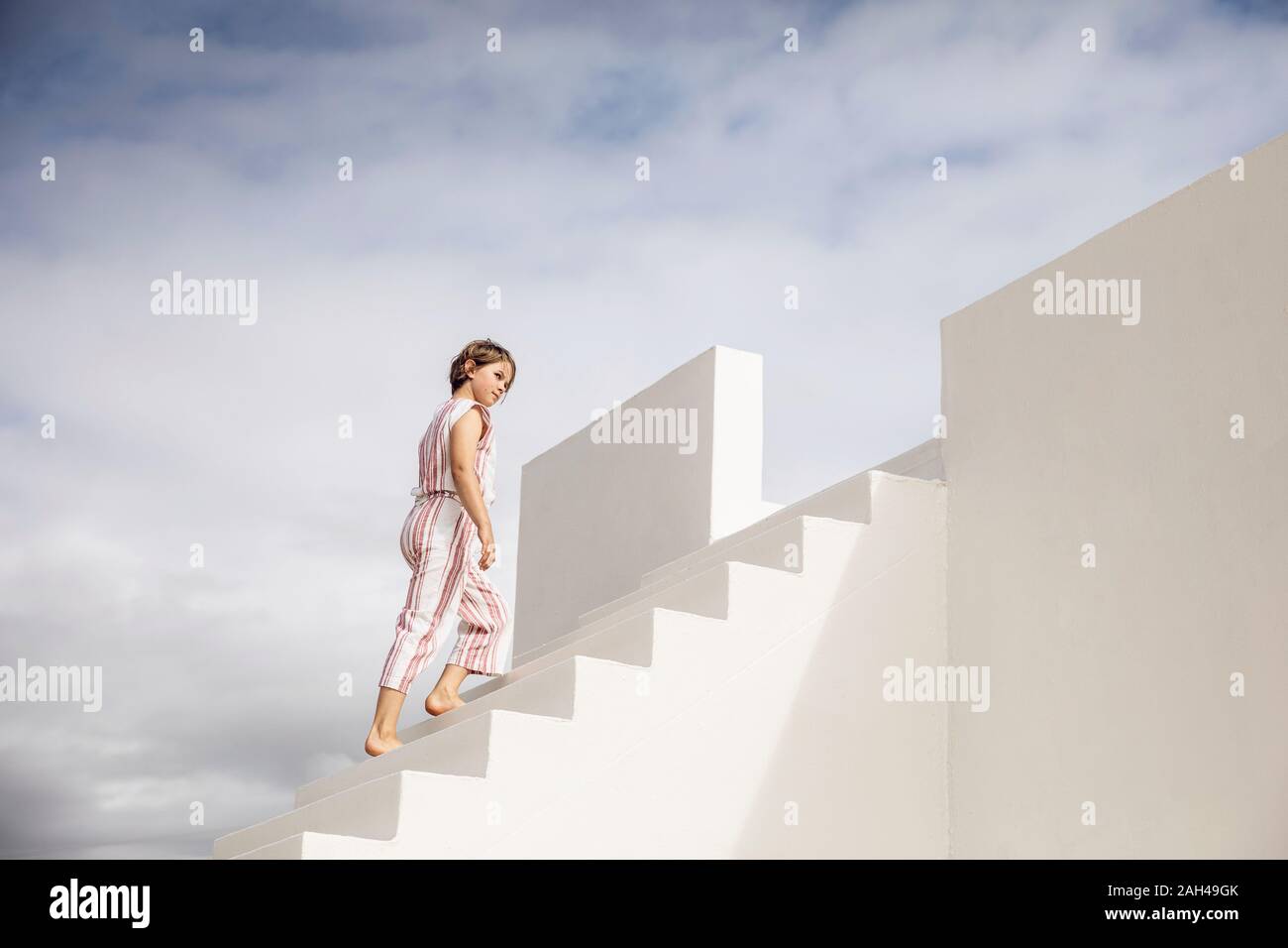 Little girl climbing stairs Stock Photo Alamy