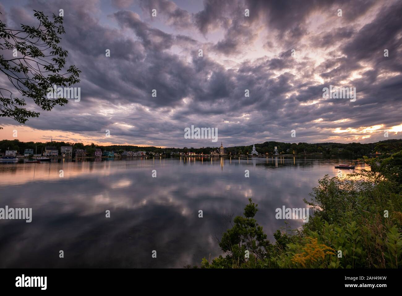 Canada, Nova Scotia, Lunenburg, Cloudy sky over Mahone Bay at dusk Stock Photo