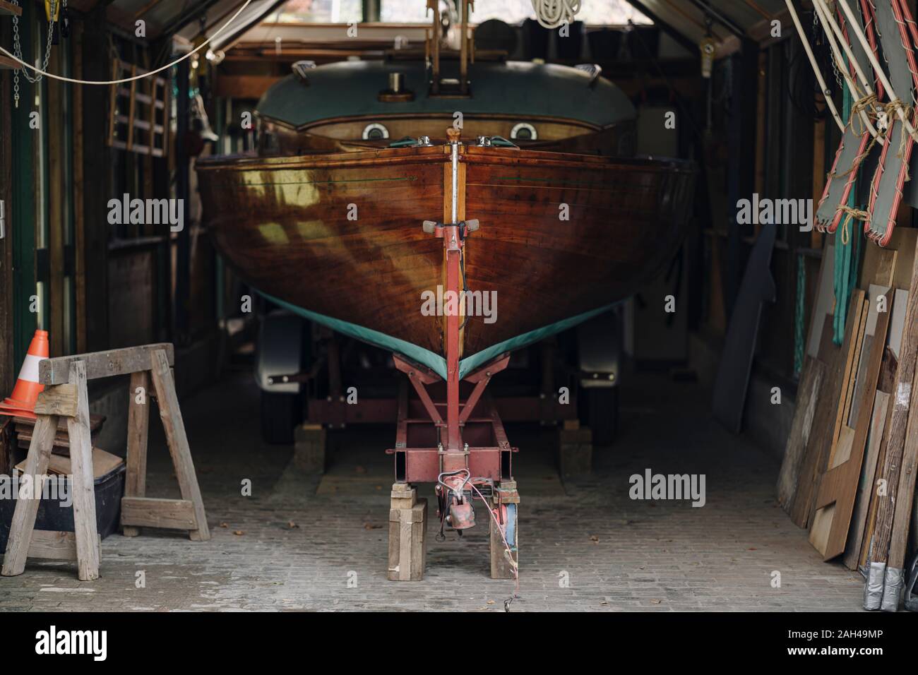 Wooden boat in a boathouse Stock Photo - Alamy