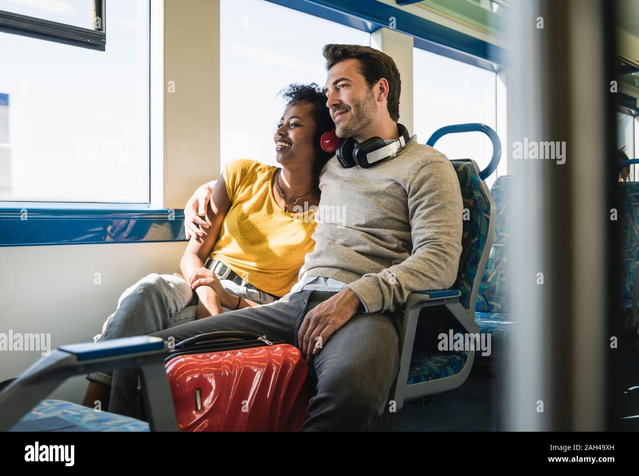 Young couple relaxing in a train Stock Photo
