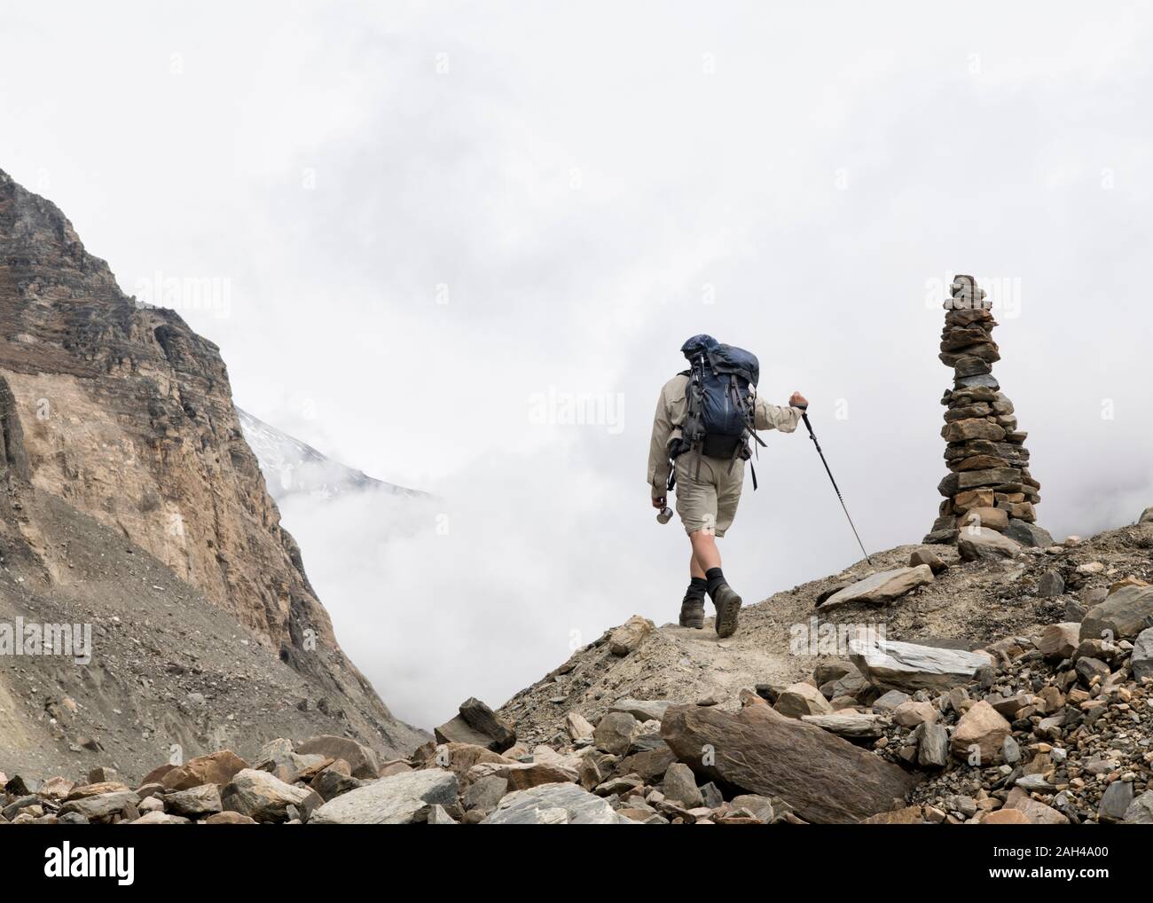 Hiker at Chonbarden Glacier, Dhaulagiri Circuit Trek, Himalaya, Nepal Stock Photo