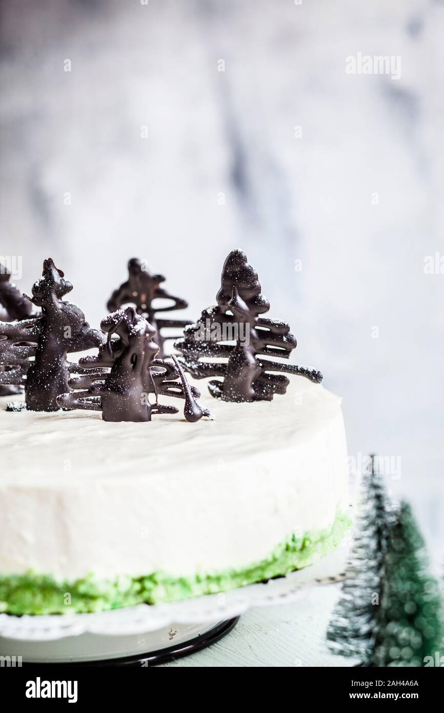 No-bake cheesecake, decorated with chocolate Christmas trees Stock Photo