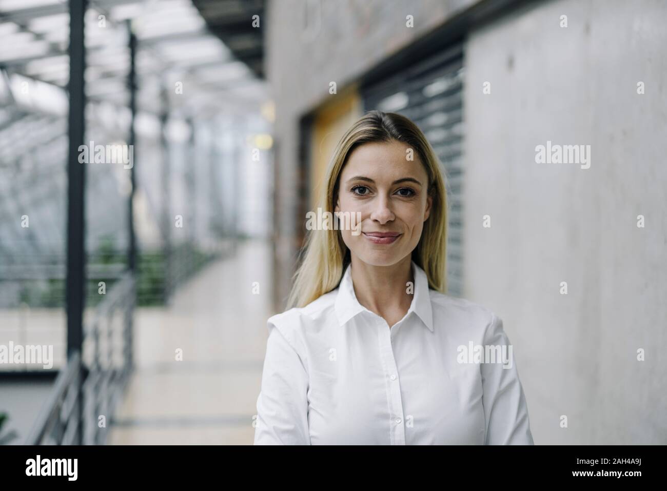Portrait of a confident young businesswoman in a modern office building Stock Photo