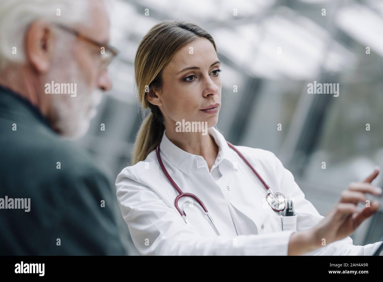 Portrait of female doctor with senior patient Stock Photo