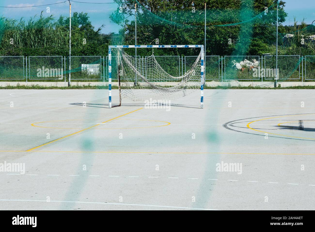 Croatia, Nin, Soccer goal standing in empty schoolyard Stock Photo
