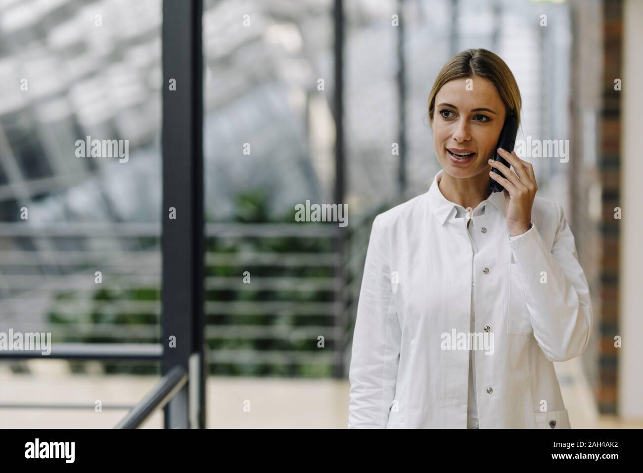 Female doctor talking on the phone Stock Photo