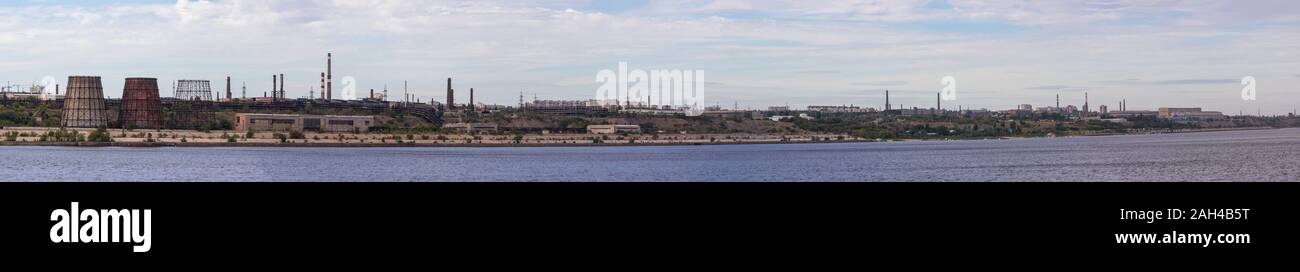 Panoramic view of ironworks located on the river coastline. Industrial landscape. Stock Photo