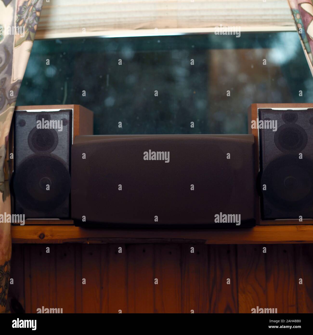 A pair of speakers and a subwoofer placed on the window sill Stock Photo Alamy