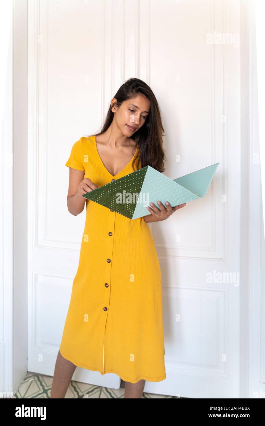 Young woman looking in folder Stock Photo