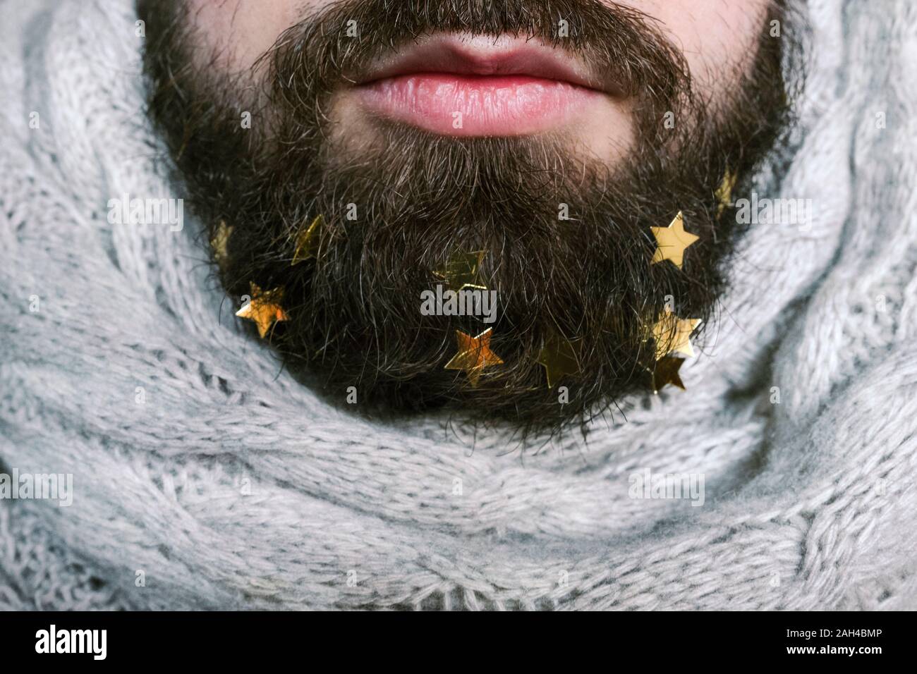 Golden stars in man's beard Stock Photo