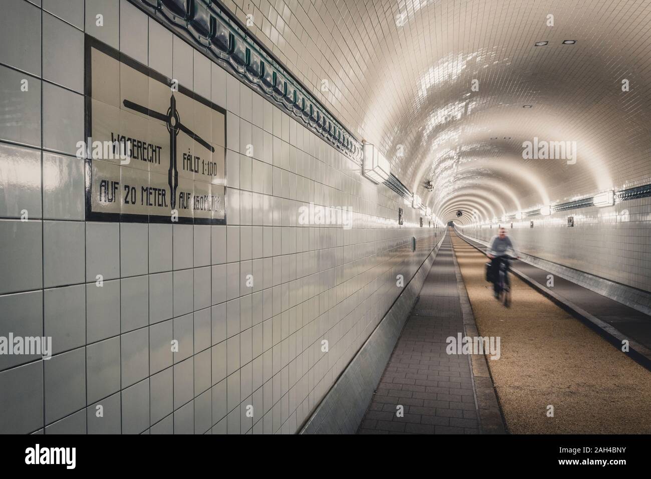 Germany, Hamburg, Cyclist in Old Elbe tunnel Stock Photo