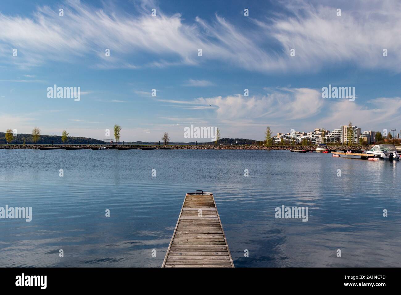 Finland, Lahti, Lakeshore jetty in spring Stock Photo