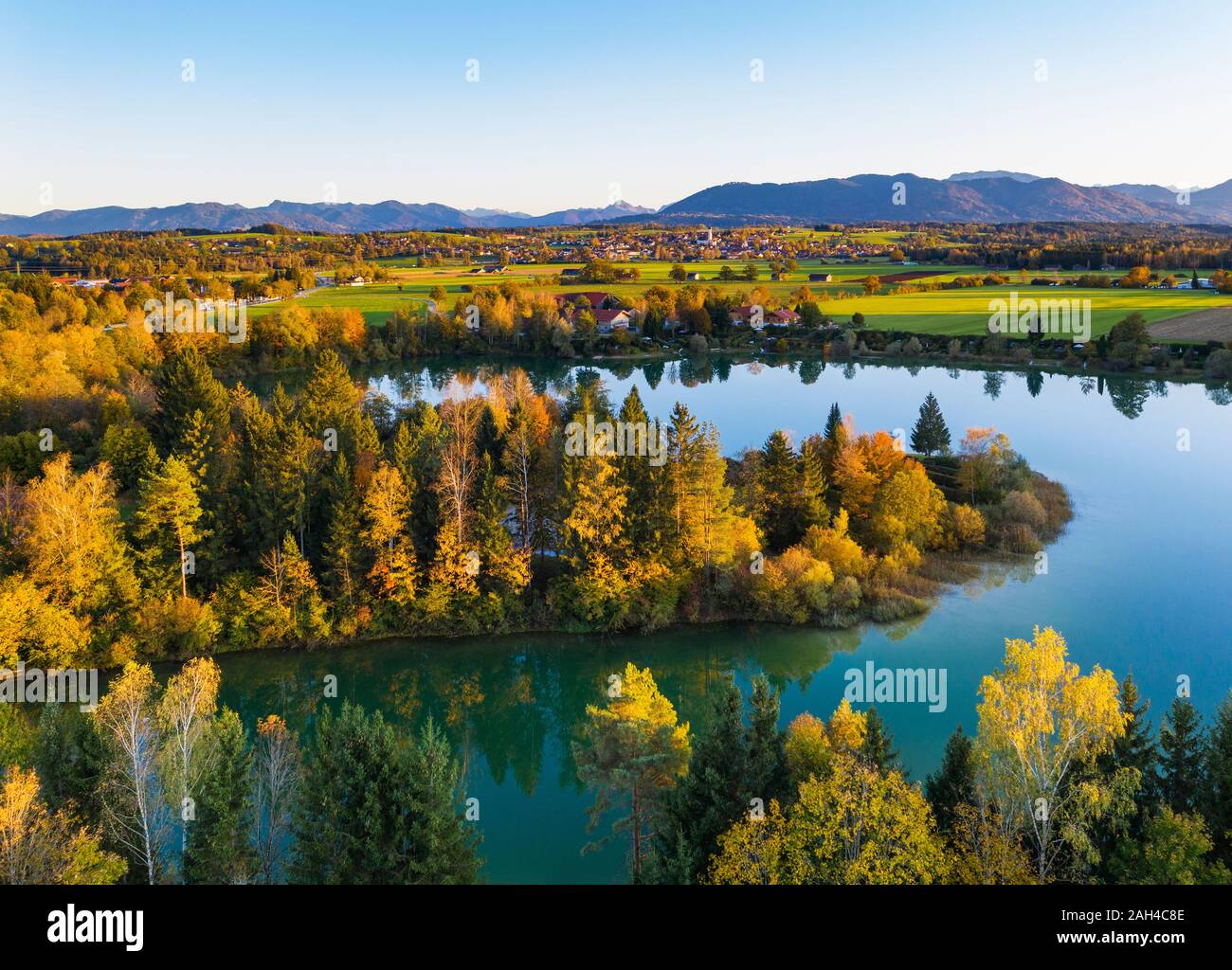 Germany, Bavaria, Upper Bavaria, Toelzer Land, Konigsdorf, Aerial view of Baggersee and forests in Autumn Stock Photo