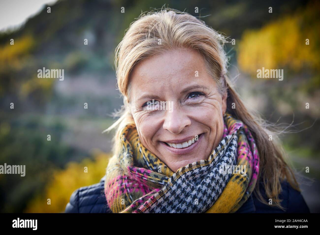 Portrait of a smiling mature woman outdoors Stock Photo